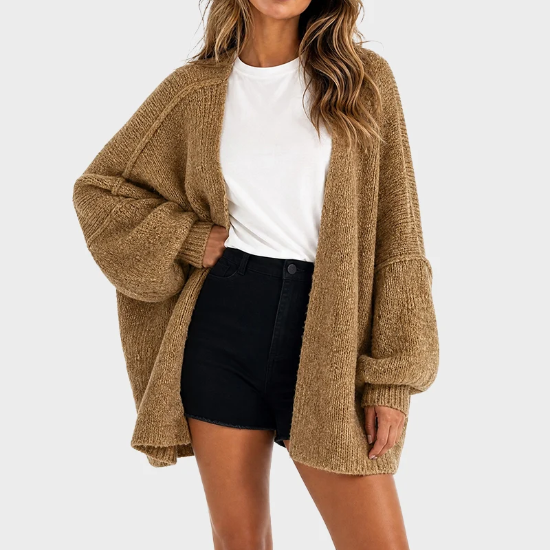 Front view of camel oversized cardigan with black shorts and white tee