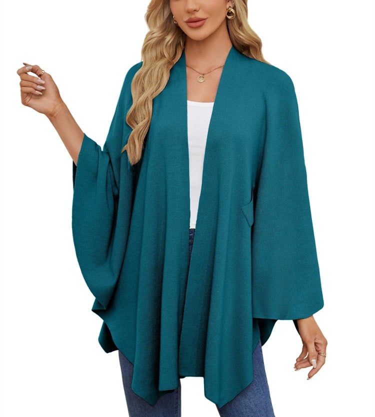 Dark cyan poncho worn open