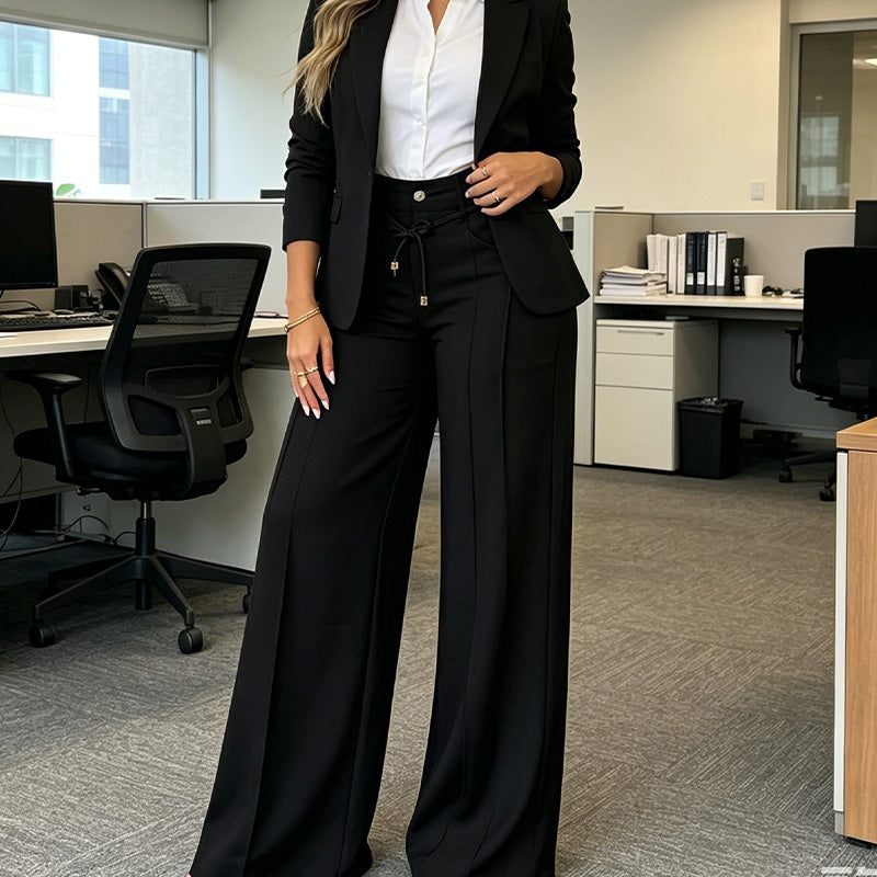 Black high-waisted straight leg trousers styled in an office