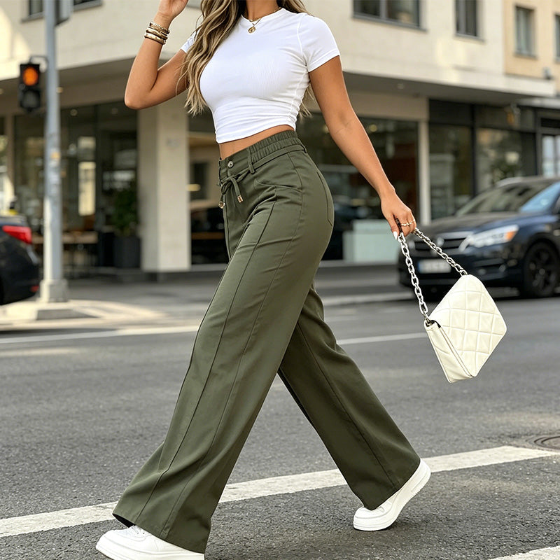 Green straight leg trousers styled for casual streetwear