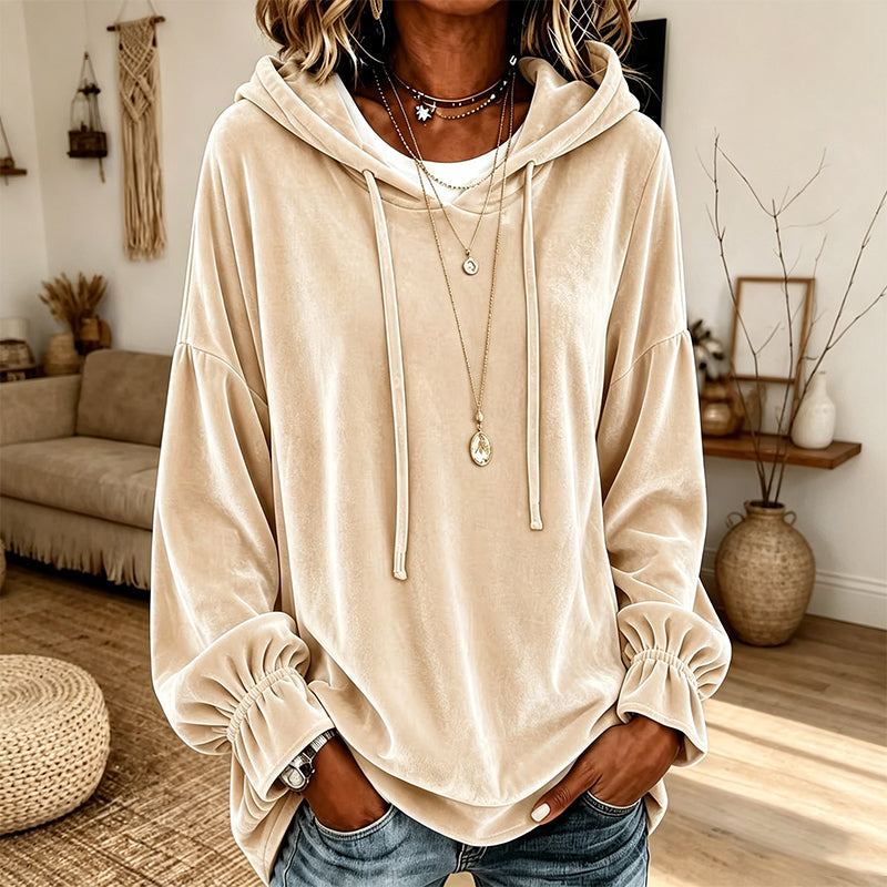 Apricot velvet hooded sweatshirt styled with jeans